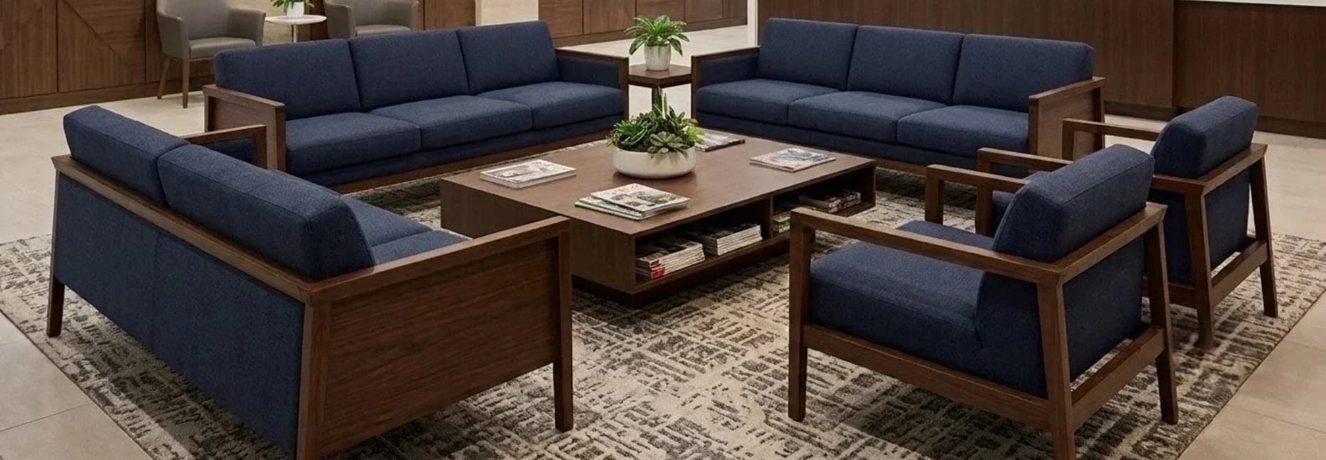Navy blue upholstered sofa set in a corporate lounge