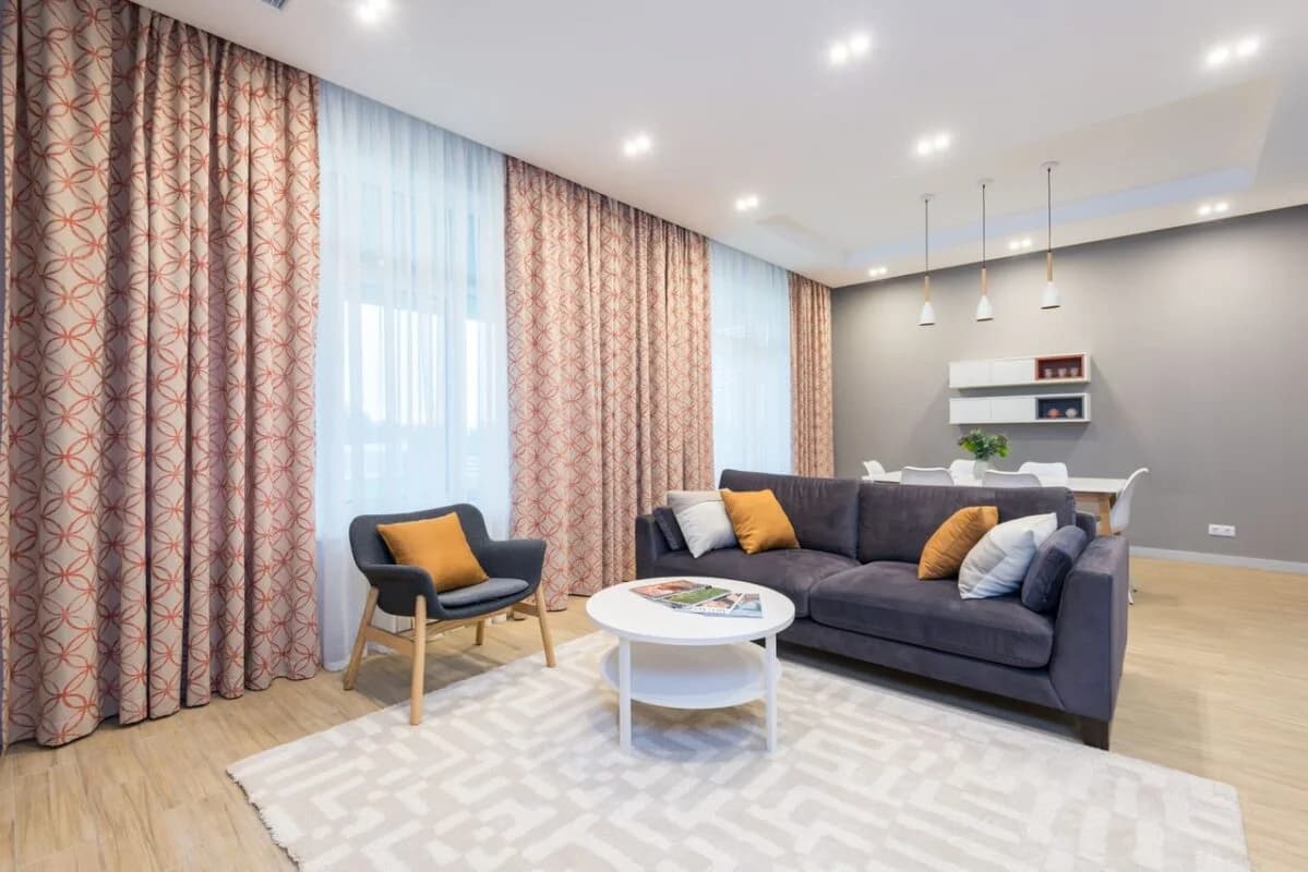Living room with digitally printed curtain fabrics
